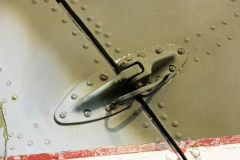Rivets on the fuselage, helicopter body close-up. Stock Photos