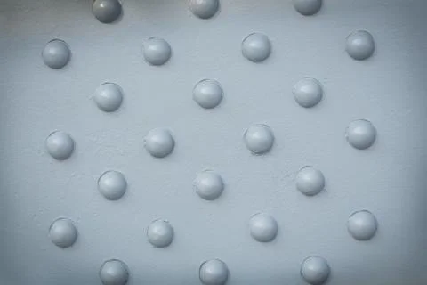 Rivets on metal surface Stock Photos