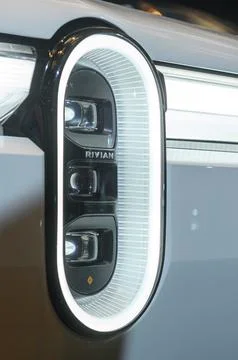 Rivian emblem on headlight. Stock Photos