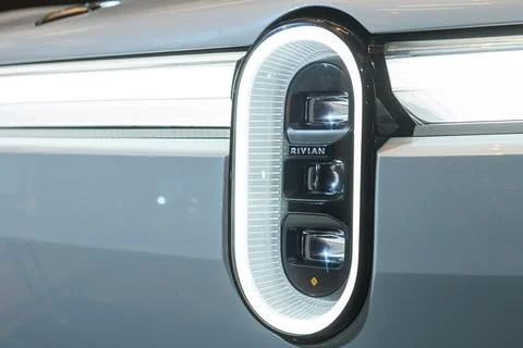 Rivian emblem on headlight. Stock Photos
