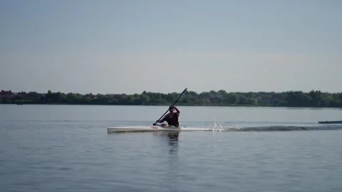 Rivne, Ukraine - August 18, 2023: People are rowing a boat on the river Stock Footage 252184828
