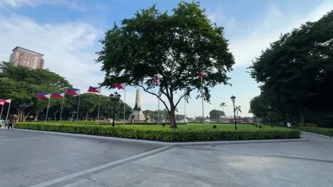 Rizal Monument and Philippine Flags, Luneta Park 4K 60fps Video stock 338400293