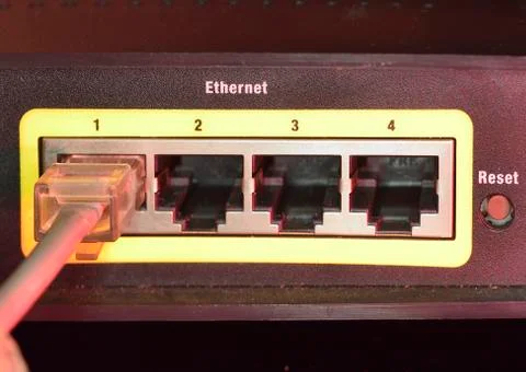 Rj45 connected to socket in router Stock Photos