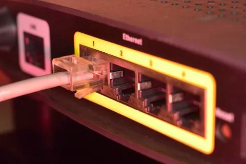 Rj45 connected to socket in router Stock Photos