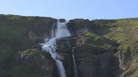 Rjukandi Waterfall Cascading Down Green Icelandic Mountain 4K Slow Motion Stock Footage 339814156