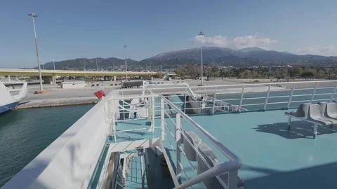 Ro-ro ferry ramp closing during departure from organized port terminal Stock Footage 338105549