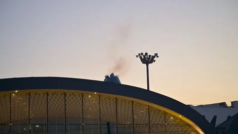 The Ro-Ro Ship Emitting Smoke at Sunset Stock Footage 296898630