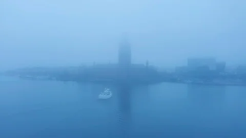 Roach Stockhol City Hall during heavy fog Stock Footage 128986964