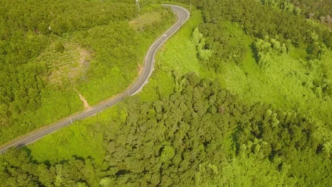 Road against the backdrop of green mountains Stock Footage 128278488