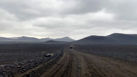 Road along black lava fields to Landmannalaugar in Iceland Stock Footage 162996773