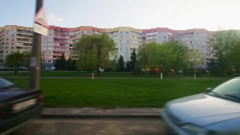 Road along nine-storey high-rise residential building in the city. Background Vidéo 255635875