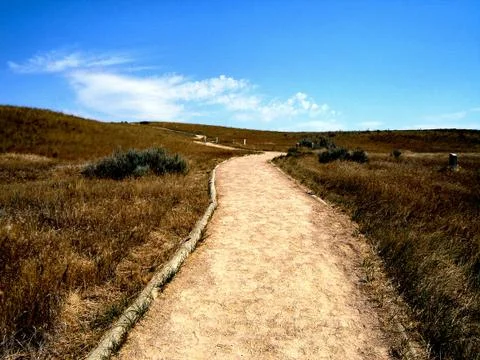 Road along the plains Stock Photos