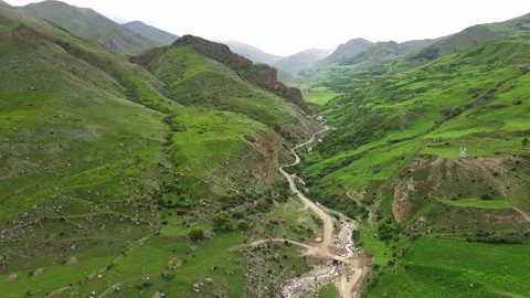 Road along the river in a mountainous area. Video stock 170855201