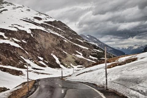 The road to the alps in the rain. Stock Photos