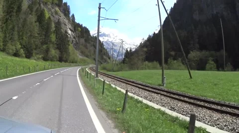 Road in Alps Switzerland green valley Stock Footage