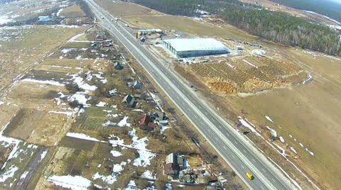 Road and buildings in rural areas. Aerial bird POV clip Stock Footage