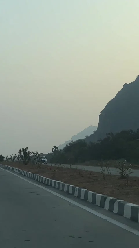 Road and mountain view from a moving object. Stock Footage 321894872