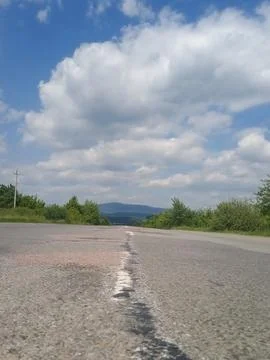 The road and the mountains Stock Photos