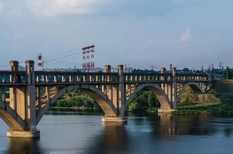 Road and rail split-level bridge over the river Stock Photos