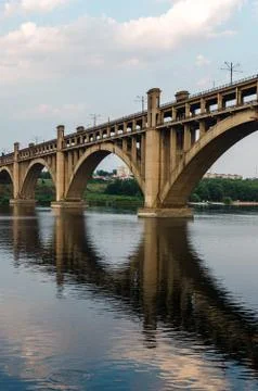 Road and rail split-level bridge over the river Stock Photos