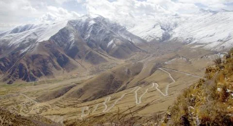 The road is the ascent to the pass. Stock Photos