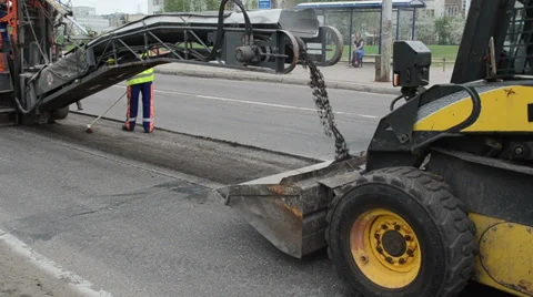 Road asphalt remain loading to rv bobcat truck woman bus stop Stock Footage 33508428