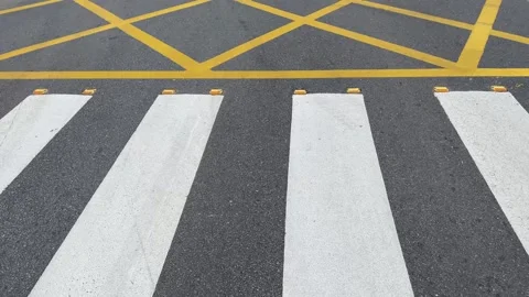 Road asphalt texture lines yellow cross pattern Stock Footage 320099813