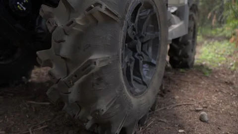 Off road ATV tire close-up in forest terrain Stock Footage 312771963