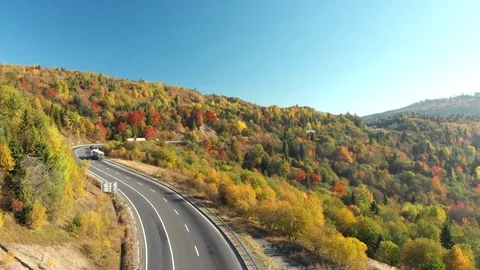 Road in autumn mountains Stock Footage 124378768