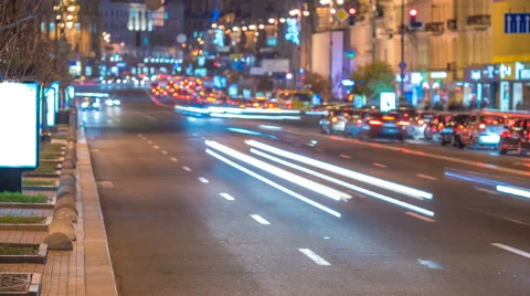The road on the background of the traffic stream. Evening night time. Time lapse Stock Footage