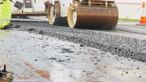 Road being paved using roller machine Stock Footage 233000763