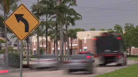 Road Bends Sign Frame Left Traffic Passing Fed-Ex Truck Stock Footage 200881070