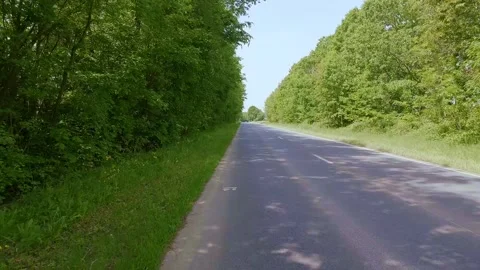 A road beneath a clear blue summer sky. 스톡 동영상 335806562