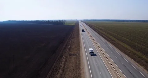 Road between agricultural fields, aerial shot Stock Footage 74473720