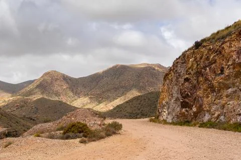Road between the arid mountains. Stock Photos
