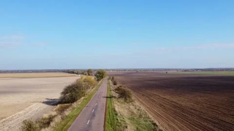 Road between fields, drone shooting, auto, Ukraine 스톡 동영상 163141454
