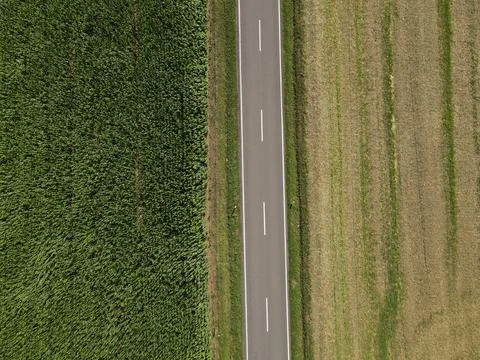 Road between fields in the landscape from above Stock Photos