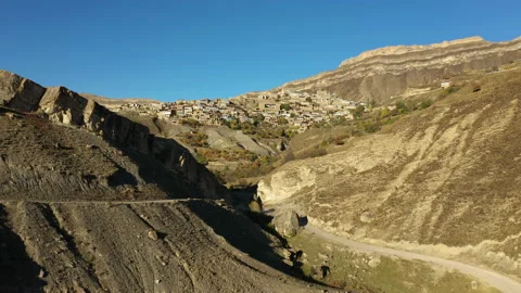 Road between mountains to ancient abandoned Chokh village Stock Footage 145333820
