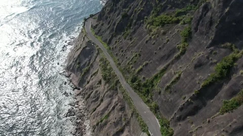 The road between the mountains and the sea Stock Footage 319907835