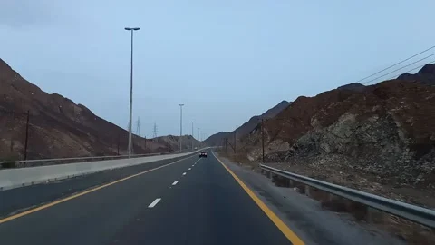 Road in-between the mountains Stock Footage 157320736