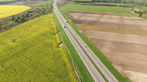 Road between rape canola field Video stock 72600458