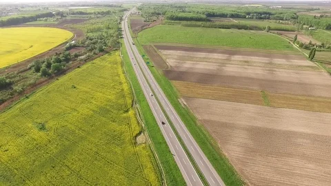 Road between rape canola field Video stock 72600842