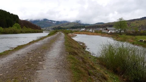 Road between the river and an artificial pond. Stock Footage 75908085