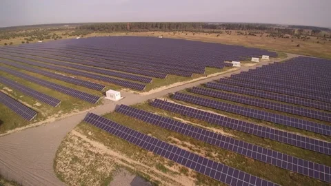 Road between rows of solar panels at rural substation farm Stock Footage 169855141