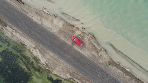 A road between two lakes with different color Stock Footage 138914322