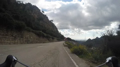 Road biker going downhill from Soller, time-lapse 6 times Video stock 56473010