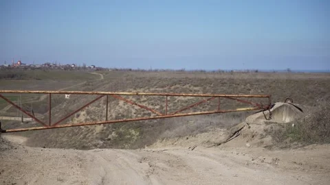 The road is blocked by an old barrier Stockbeeldmateriaal 312890545