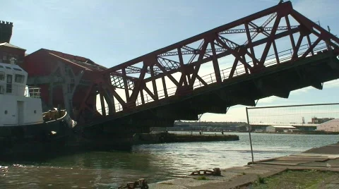 Road bridge being raised to allow ship to enter dock Stock Footage 67305