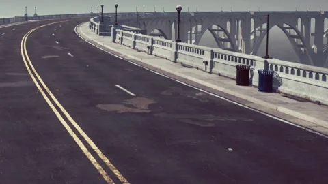 Road on a bridge with empty space and fog on either side during day Stock Footage 340028745