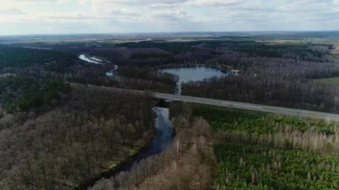 Road with a bridge over the lake Stock Footage 265757342